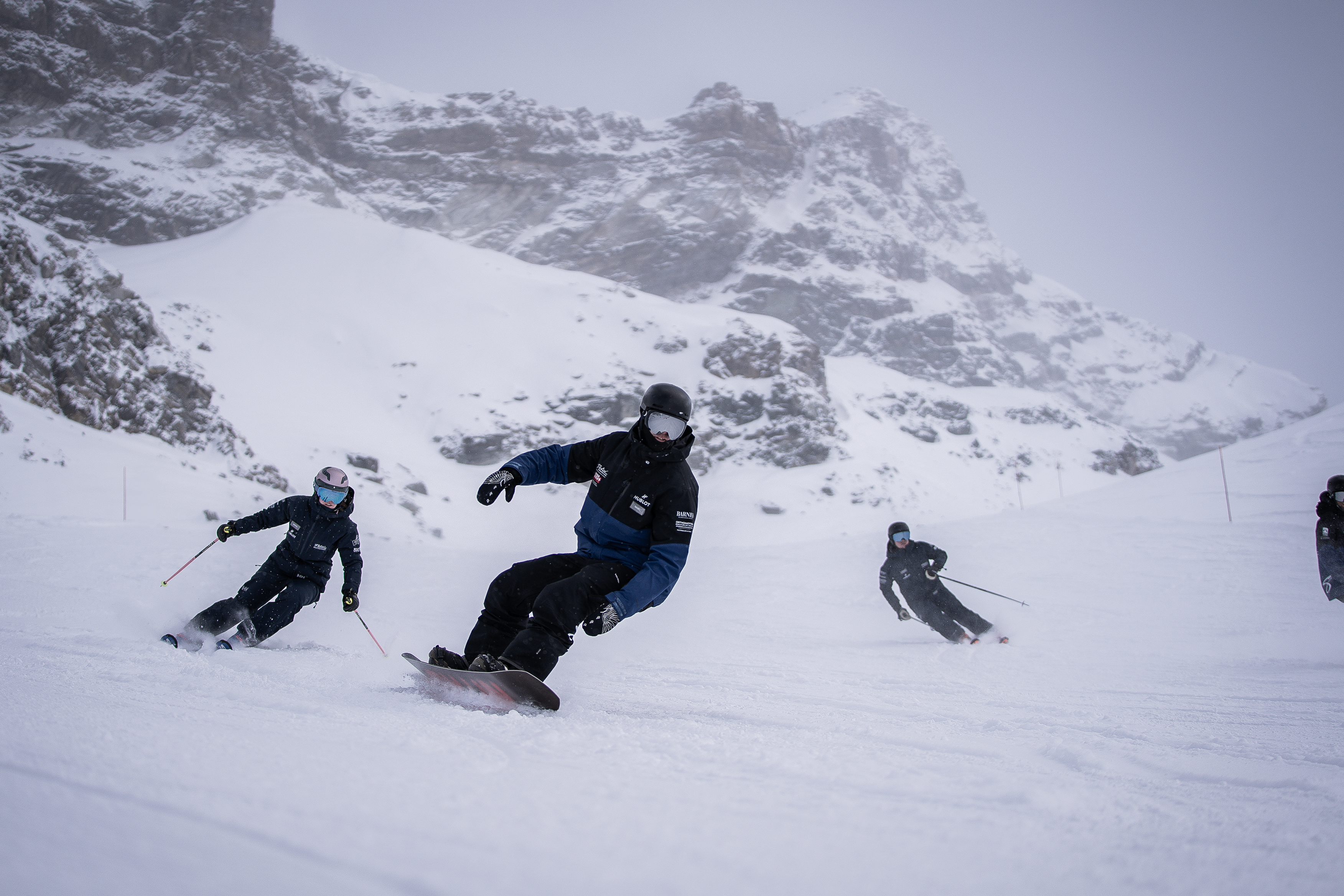 kids snowboard lessons with an instructor in Zermatt